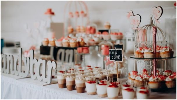 Height, Lighting, and Signage That Make the Table Pop